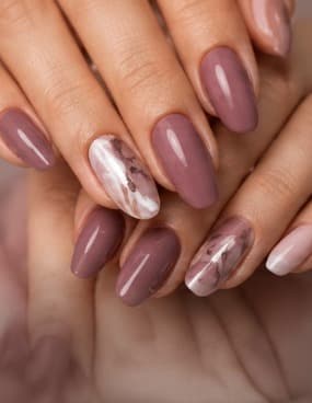 Mauve gel extensions with white marble accent nails