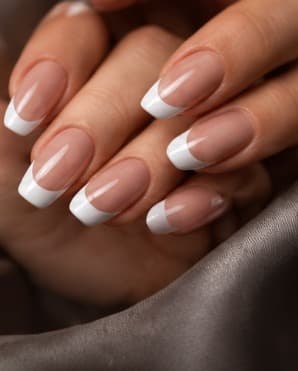 French manicure with a nude base and crisp white tips